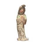 A Chinese painted pottery figure of a court lady Tang dynasty Potted and painted with a gentle ...