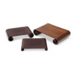 Three Chinese hardwood scholar's stands 20th century Each of plain rectangular form with scroll...