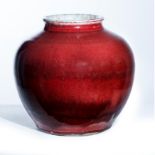 A Chinese copper-red glazed oviform jar Qing dynasty, 19th century The thickly-potted vessel co...
