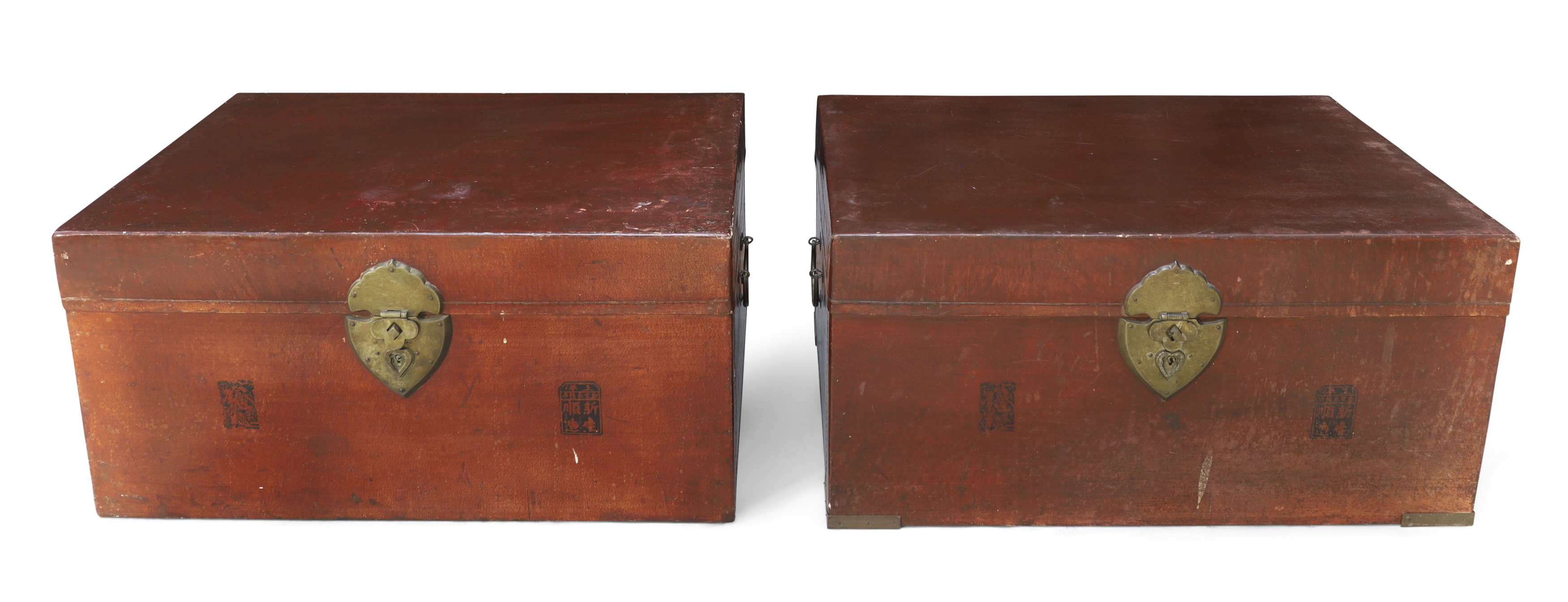 Two Chinese red painted travelling trunks Early 20th century With swing carry handles and brass...