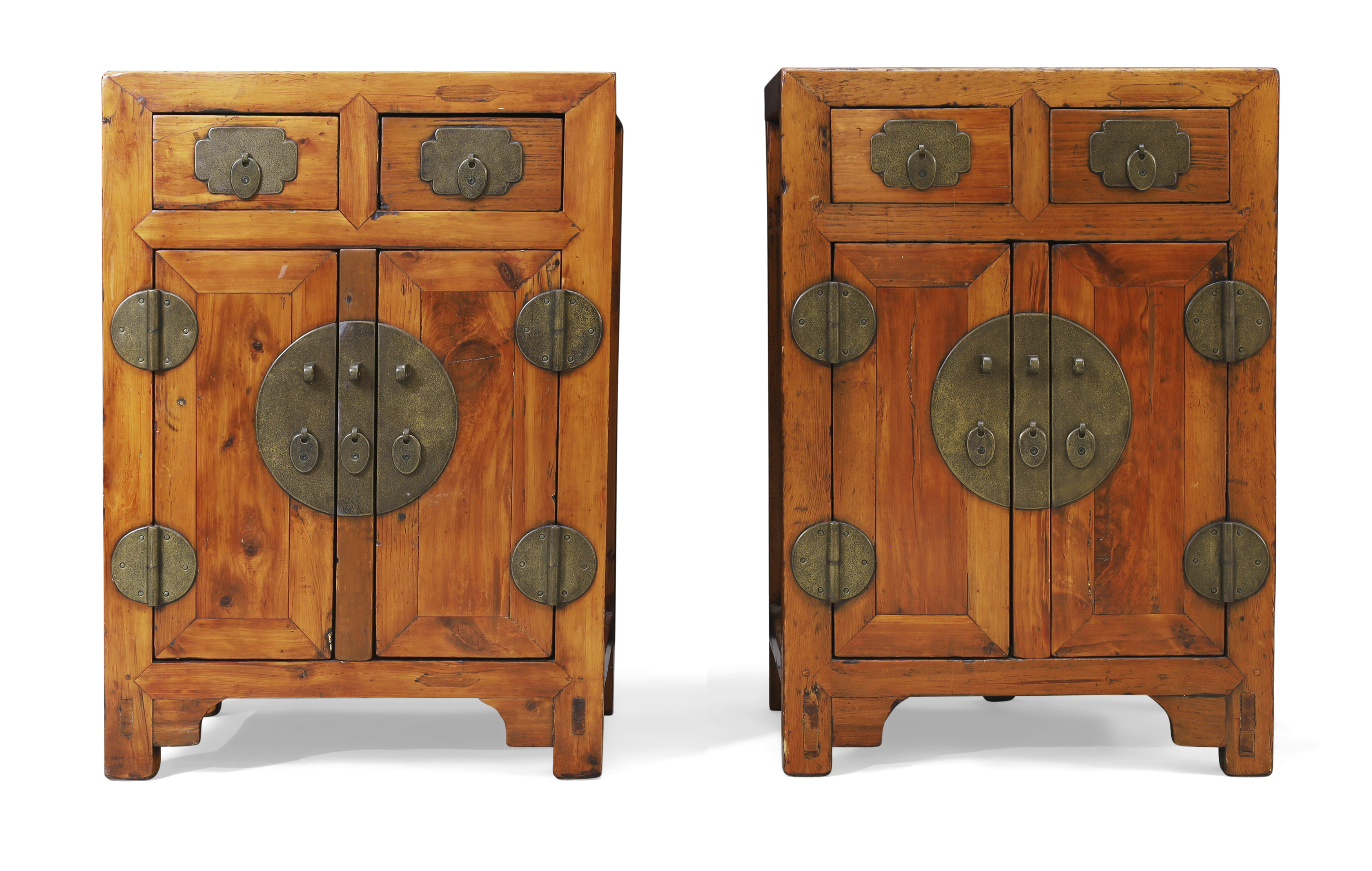 A pair of Chinese elm small cabinets 20th century Of rectangular form with two frieze drawers a...