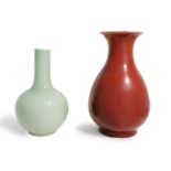 A Chinese monochrome copper red pear shaped vase, yuhuchun, and a celadon bottle vase 19th - 20t...