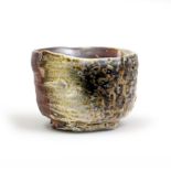 Martin McWilliam (1957-) A thickly potted Chawan teabowl, encrusted with fly ash and rich glazed...