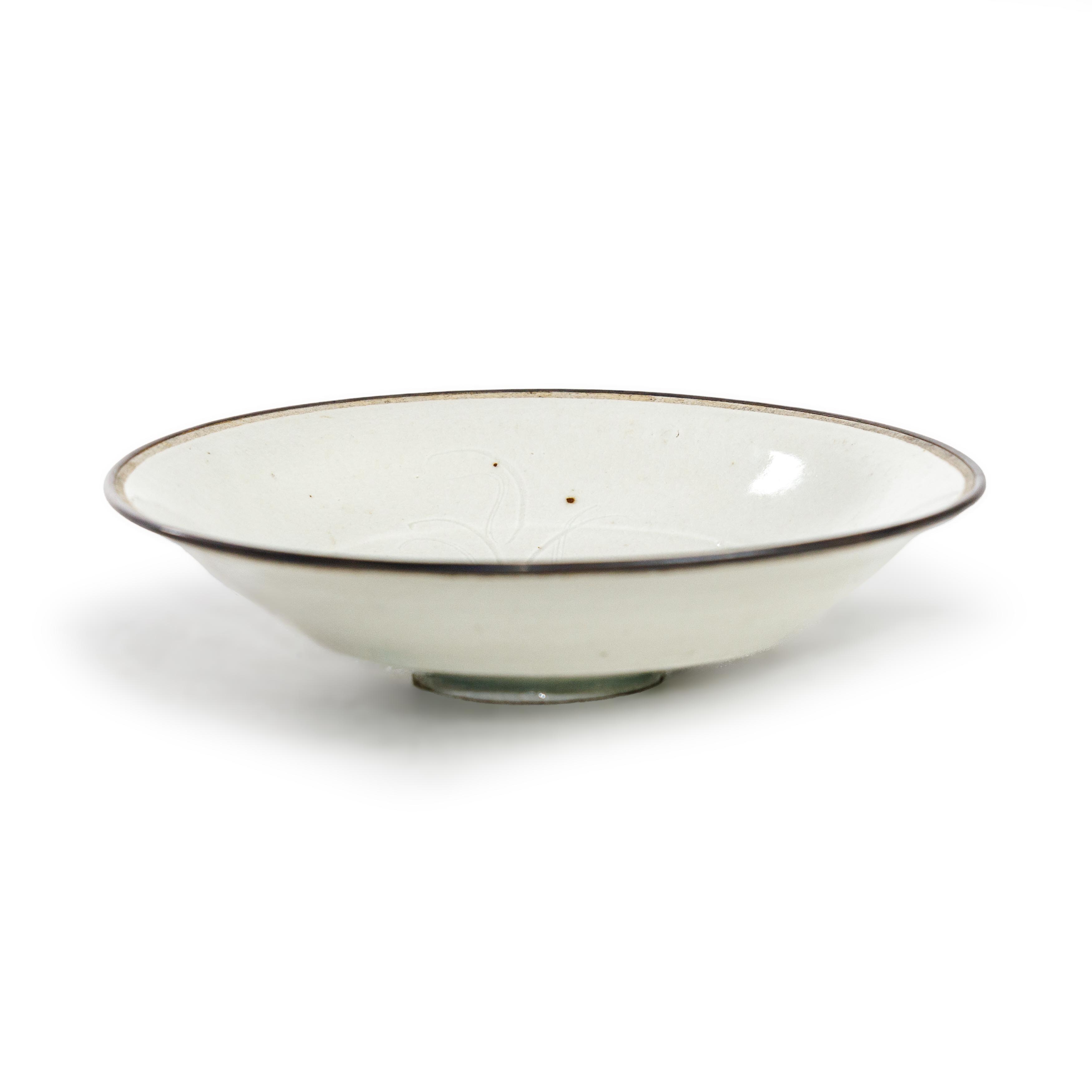 A Chinese 'Ding-style' qingbai-glazed dish  Song dynasty The dish thinly potted with a stepped ... - Image 2 of 2