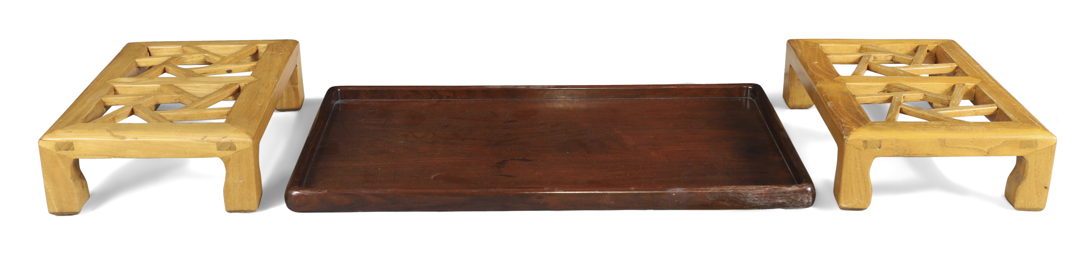 A Chinese rosewood rectangular tray and a pair of elm 'cockpen' footstools Republic period The ...