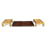 A Chinese rosewood rectangular tray and a pair of elm 'cockpen' footstools Republic period The ...