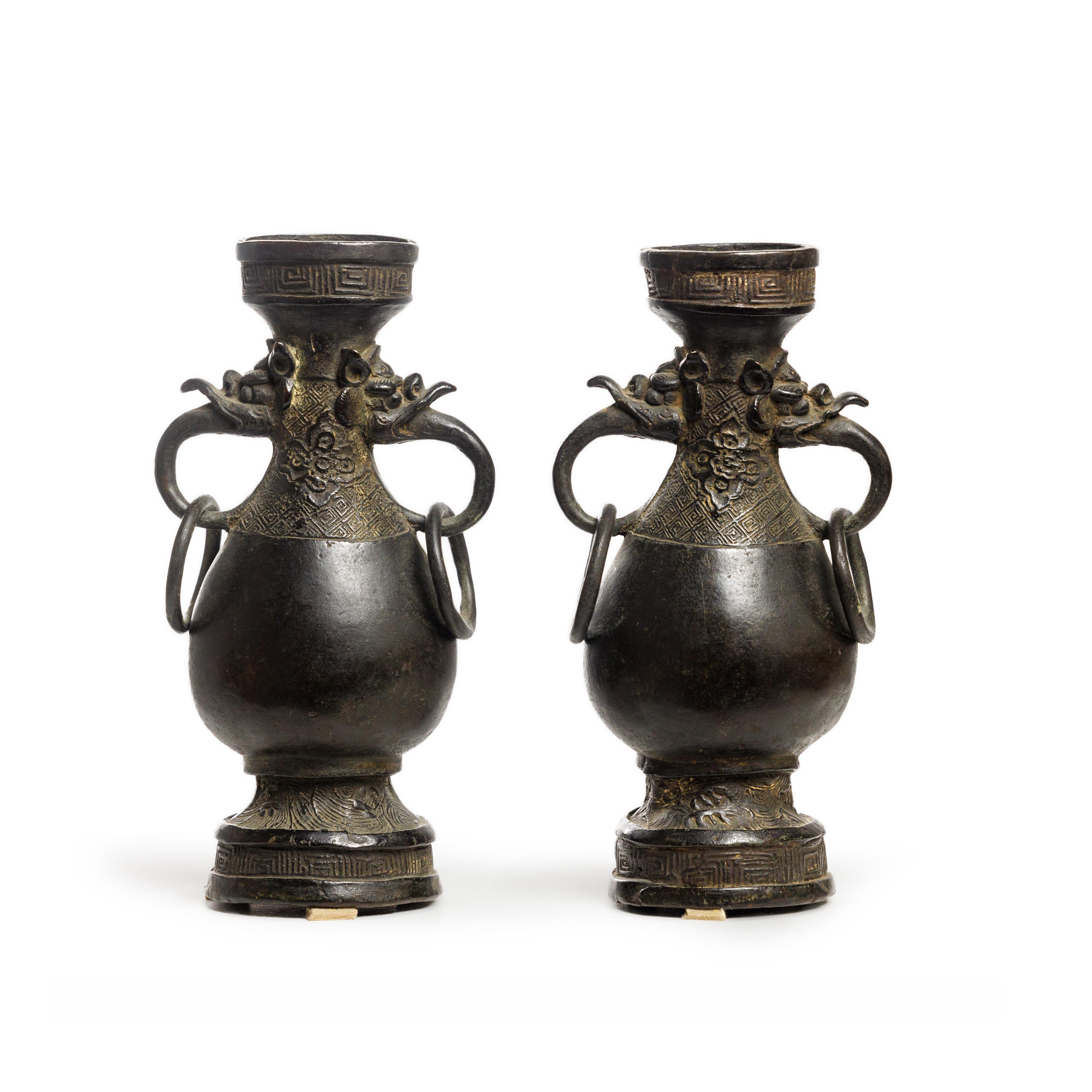 A pair of Chinese archaic bronze vases, hu Early Ming dynasty Each with wide mouth above slende...