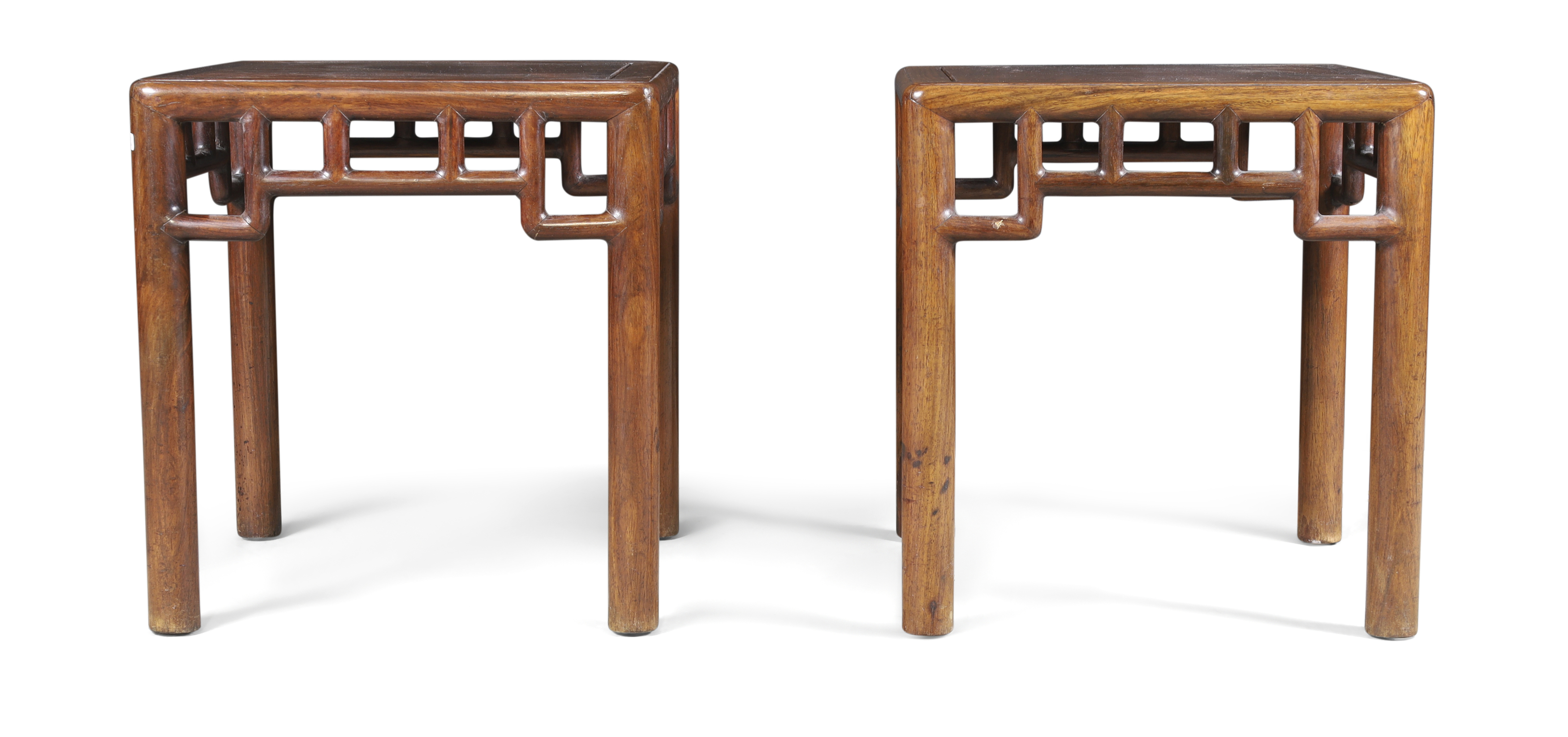 A pair of Chinese hongmu Ming style stools Qing dynasty, 19th century The square top above arch...