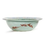 A Chinese famille rose celadon-ground basin Qing dynasty, 19th century The well enamelled with ...