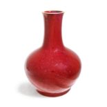 A Chinese flambé-glazed bottle Qing dynasty, 18th/19th century  The thickly-potted vessel typic...