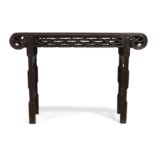 A Chinese hardwood altar table 20th century The rectangular top with scroll ends above pierced ...