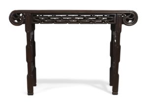 A Chinese hardwood altar table 20th century The rectangular top with scroll ends above pierced ...