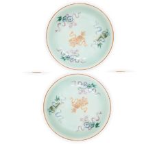 Three Chinese famille rose 'lion dog' dishes Qing dynasty, 19th century Painted to the interior...