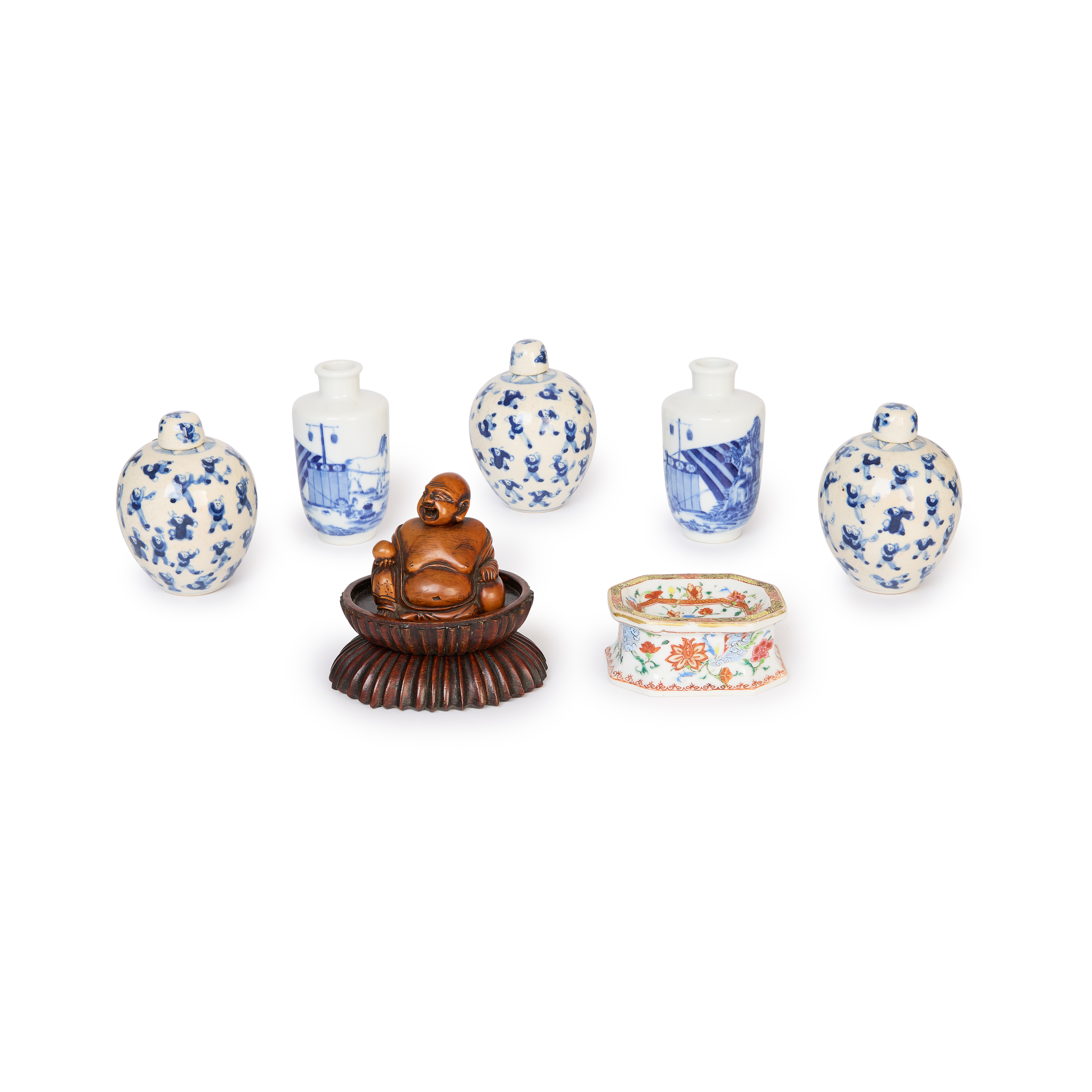 Five Chinese blue and white vases, a famille rose stand and a wood figurative carving Qing dynas...