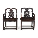 A pair of Chinese hongmu armchairs Qing dynasty, 19th century With carved central splat decorat...