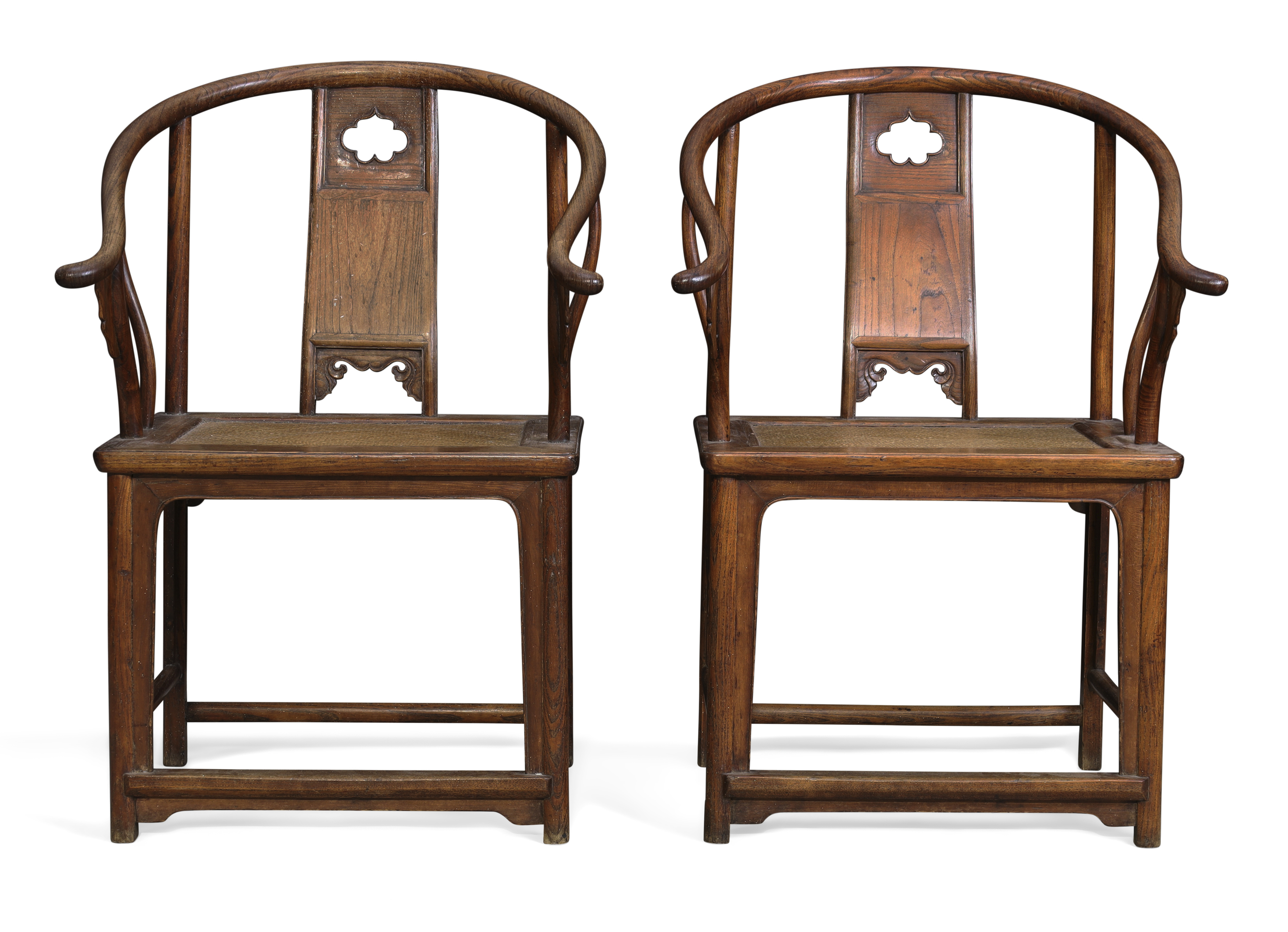 A pair of Chinese elm horseshoe back armchairs Late Qing dynasty With curved top rail above cen...