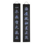 A Chinese porcelain inset wood hanging couplets Late Qing / Republic period Each of rectangular...