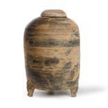 A Chinese earthenware model of granary Han dynasty The brownish grey cylindrical body with bows...