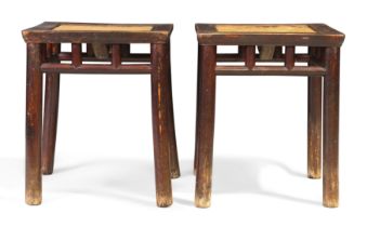A pair of Chinese provincial lacquered elm stools, Late Ming dynasty, 17th century The square t...
