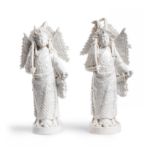 A pair of Chinese Dehua figures of warriors 20th century Each modelled standing wearing robes m...