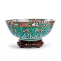 A Chinese Canton famille rose 'baicai' punchbowl Qing dynasty, 19th century Elaborately painted...