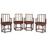 A set of four Chinese yumu armchairs Republic period With spindle backs above shaped recessed s...