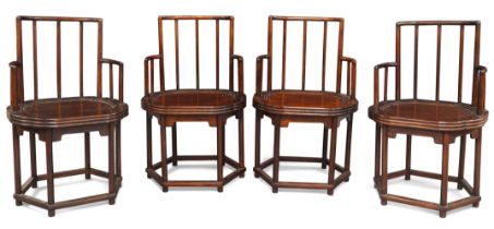 A set of four Chinese yumu armchairs Republic period With spindle backs above shaped recessed s...