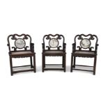 A set of three Chinese hongmu marble inset armchairs Qing dynasty, Guangxu period The backs set...