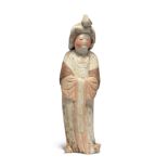 A Chinese pottery figure of a court lady, Tang dynasty Modelled standing swaying to the right w...