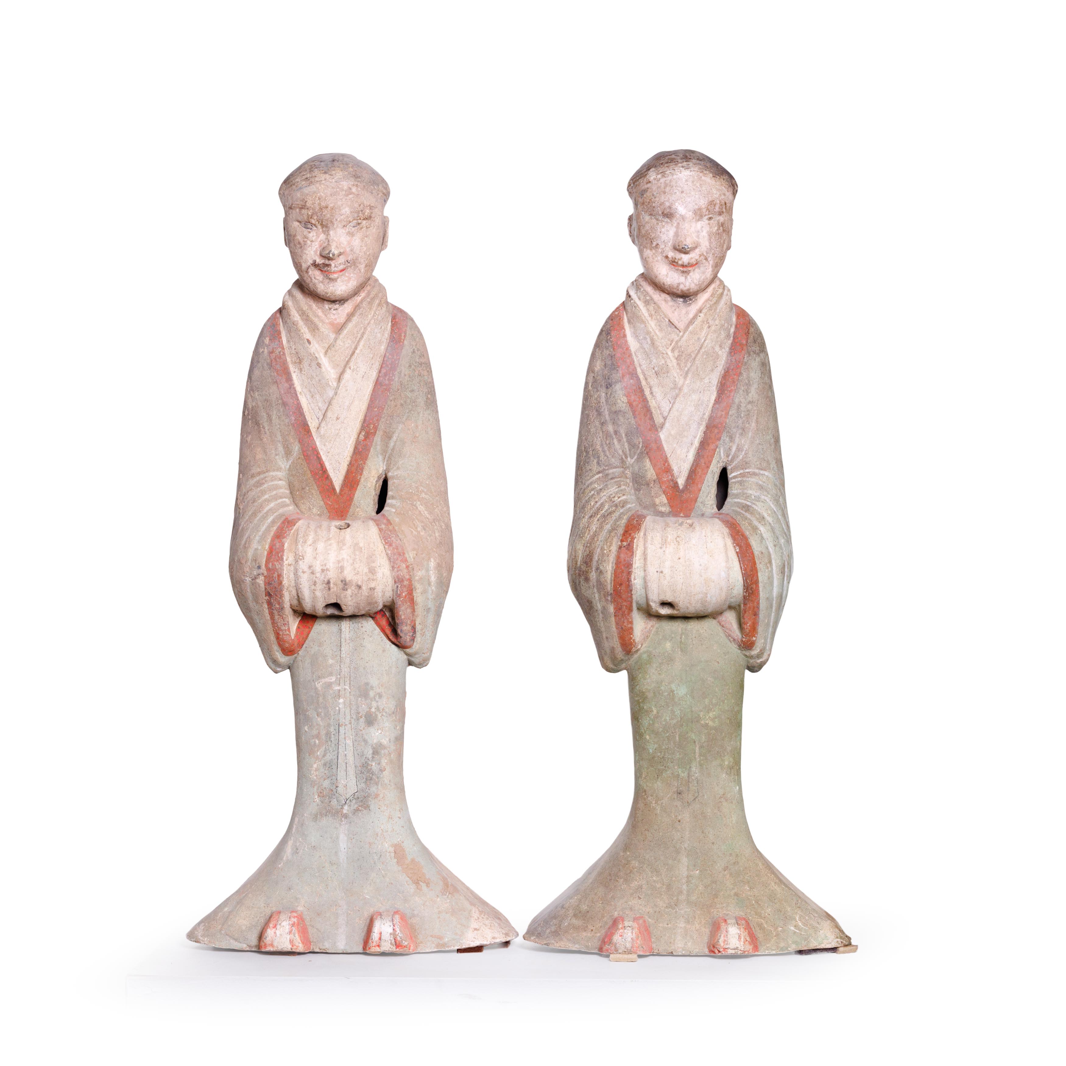 Four large Chinese pottery figures of attendants Han dynasty Each modelled standing wearing pai... - Image 3 of 3