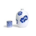 A Japanese blue and white bottle vase and a cup Edo period, 18th- Meiji period, 19th century  C...