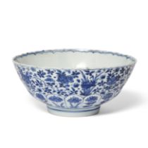 A Chinese blue and white moulded 'floral' bowl Qing dynasty, Kangxi period The circular bowl mo...