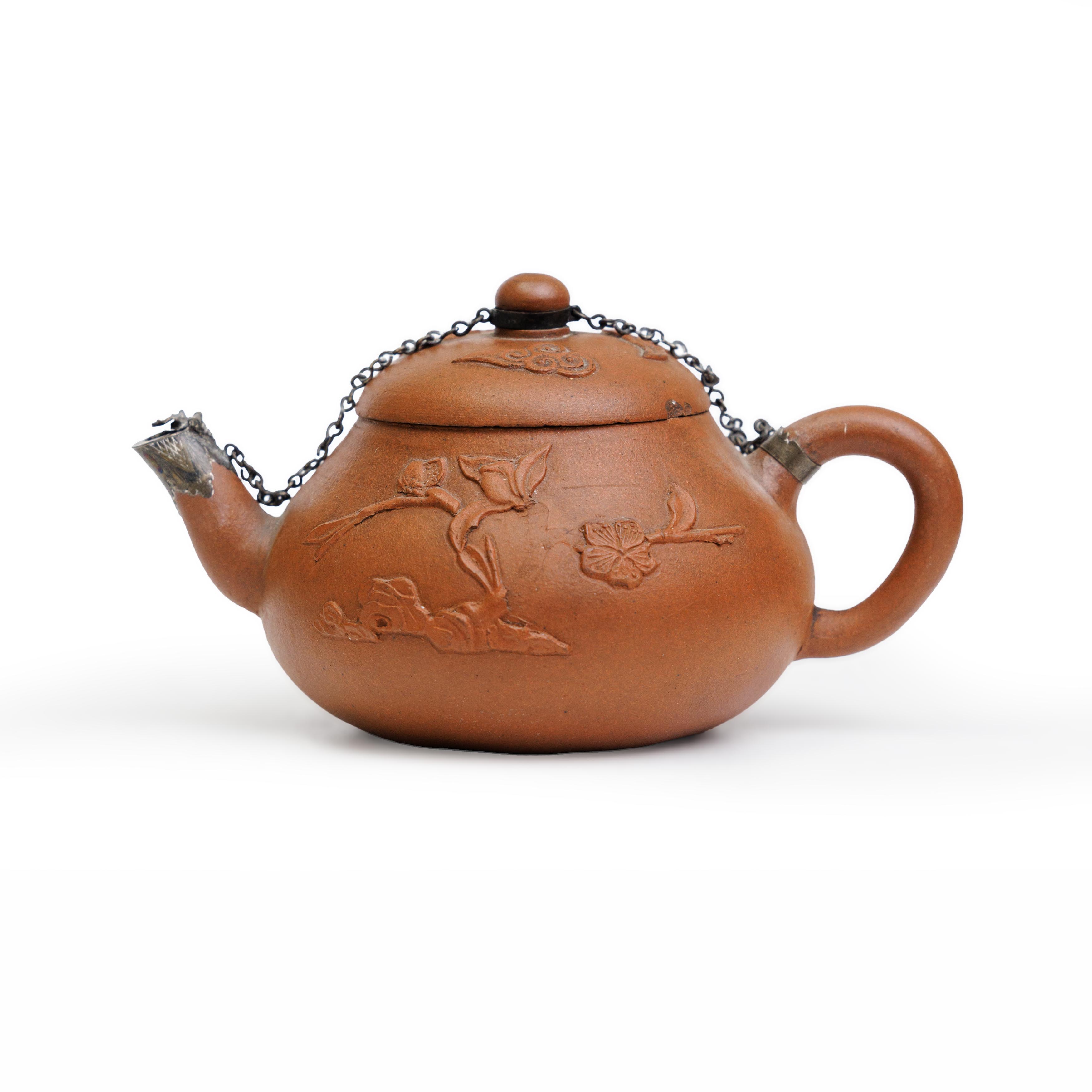 A Chinese Yixing red clay teapot with applied decoration Early Qing dynasty, 17th/18th century ...