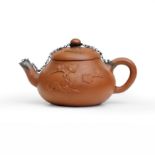 A Chinese Yixing red clay teapot with applied decoration Early Qing dynasty, 17th/18th century ...