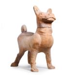 A Chinese pottery figure of a hound Tang dynasty Modelled standing four square, with detachable...