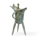 A Chinese Shang-style bronze tripod wine pouring vessel, jue 20th century With loop handle cast...