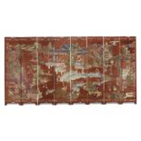 A Chinese eight section carved lacquer screen Qing dynasty, 18th century Carved and painted to ...