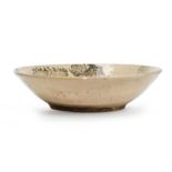 A Chinese Swatow bowl Qing dynasty Raised on short foot with thick rim, paitned to the interior...