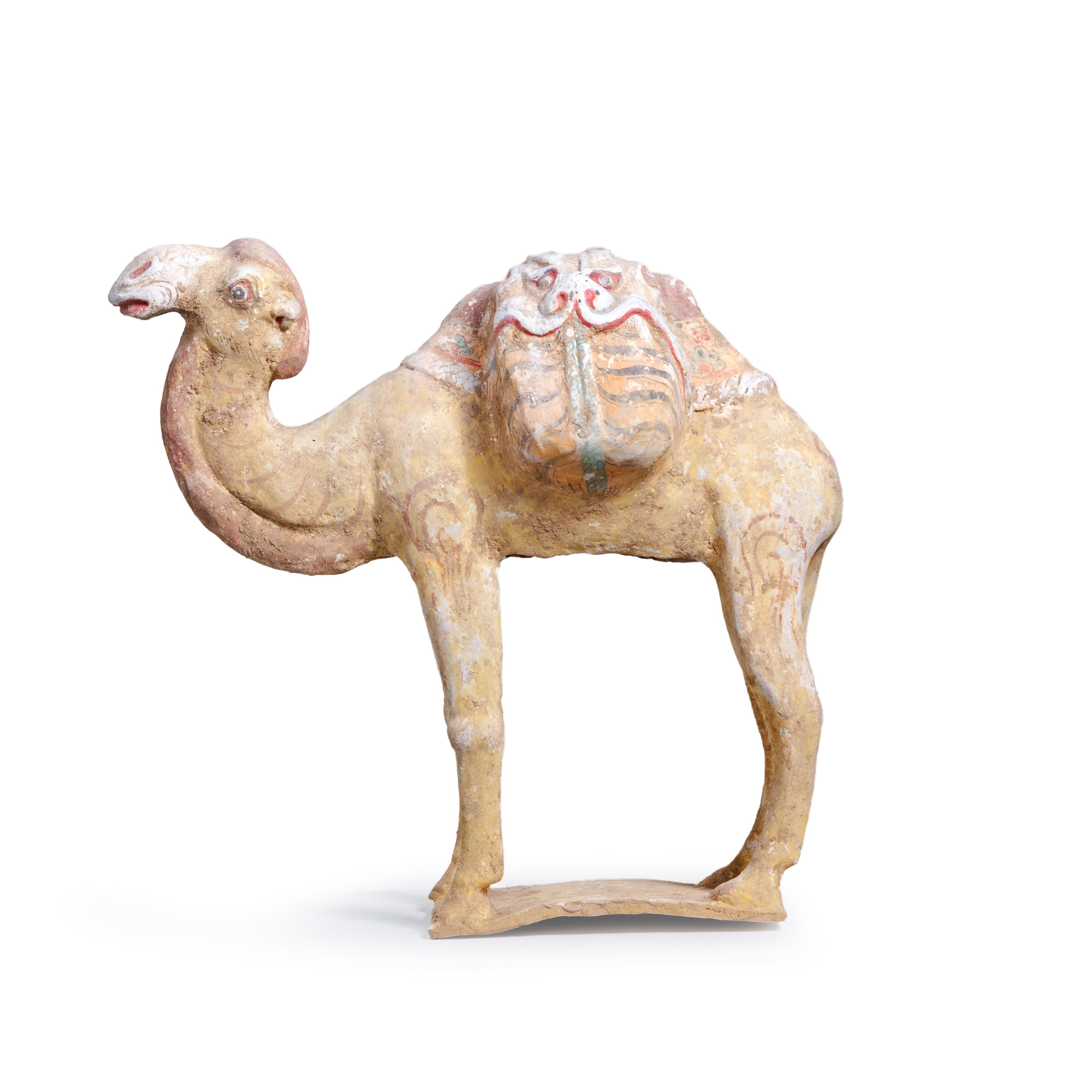 A large Chinese pottery figure of a camel Tang dynasty Standing four square with laden saddle w...