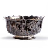 A Chinese silver bowl Early 20th century Of circular form with lobed rim on a flared foot, deco...