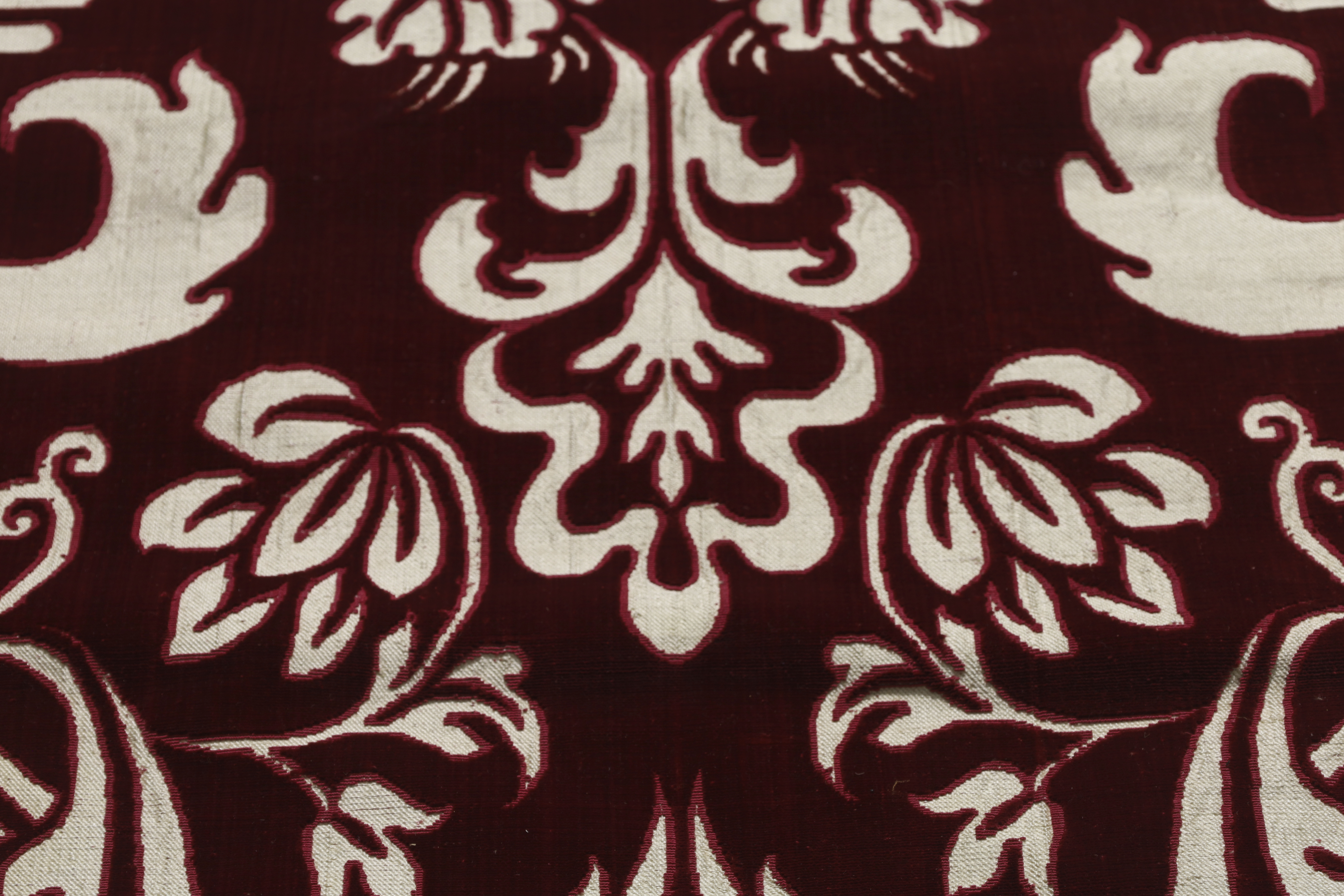 A cut velvet panel, Late 19th century,  With an ogival lattice voided to ivory silk, later backed... - Image 3 of 4