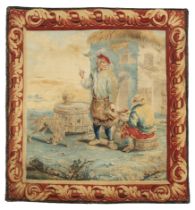 A Flemish tapestry panel, 19th century, Woven in wools and silks, depicting a man stood beside a ...