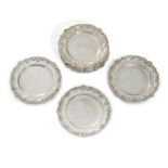 A set of twelve Elizabeth II silver side plates, London, 1962, Collingwood & Co., Of shaped circu...