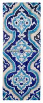 A moulded turquoise and cobalt blue glazed tile panel, Multan, North India, late 18th / early 19t...