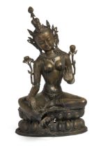 A massive Tibetan copper alloy figure of Tara, Early 20th century, Seated in lalitasana on a pier...