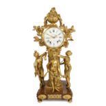 A French gilt-bronze mantel clock, Early 19th century, The case surmounted by a flowering urn and...