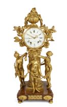 A French gilt-bronze mantel clock, Early 19th century, The case surmounted by a flowering urn and...