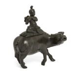A Chinese bronze ‘boy on buffalo’ censer, 17th / 18th century, Modelled as a boy seated playing a...