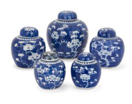 Five Chinese blue and white 'prunus' jars and covers, Late 19th - early 20th century, Each decora...