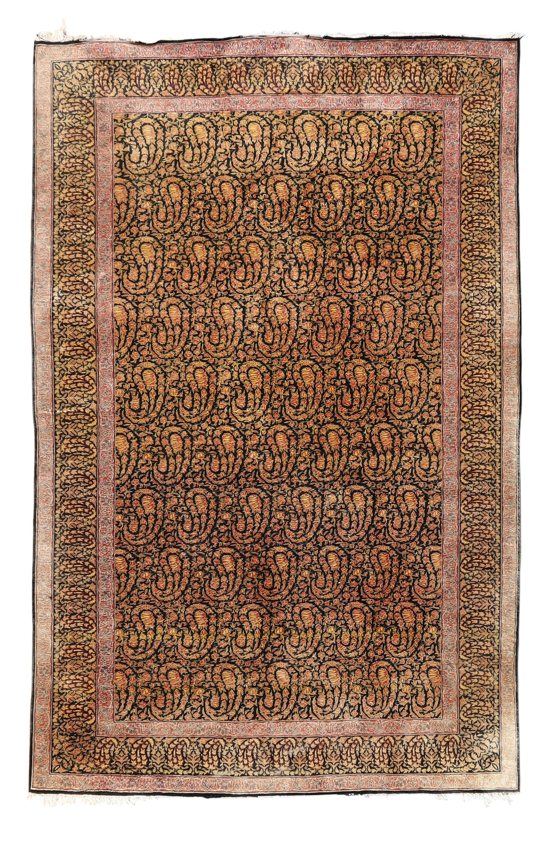 A Persian silk Qum rug, Second quarter 20th century,  With paisley design on a back and terracott...